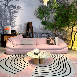 RINGCHEN modern curved cloud sofa featuring premium blush textured upholstery, highlighted by its signature sculptural low-profile silhouette, channel-tufted base detailing, and deep-seated organic cushioning for a high-end minimalist living room aesthetic.-Front view