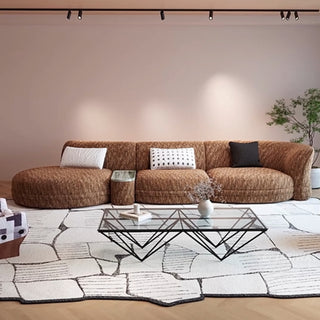 RINGCHEN modern Italian modular sectional sofa featuring a sculptural curved design and deep seat cushions, upholstered in a textured fabric. This low-profile luxury couch showcasing high-end craftsmanship, organic biomorphic contours, and an integrated small side table, designed for contemporary upscale living room decor and premium home styling.-Front view