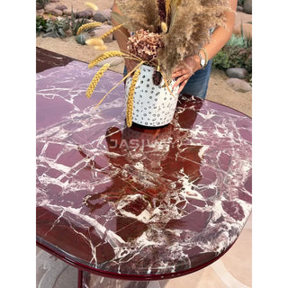 RINGCHEN modern minimalist oval dining table featuring a luxurious lava red marble and engineered solid wood, supported by unique sculptural legs with a high-gloss burgundy interior and matching marble exterior, perfect for elegant luxury dining room centerpieces.-Top surface close-up