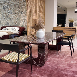 RINGCHEN modern minimalist oval dining table featuring a luxurious lava red marble and engineered solid wood, supported by unique sculptural legs with a high-gloss burgundy interior and matching marble exterior, perfect for elegant luxury dining room centerpieces.-Diagonal view