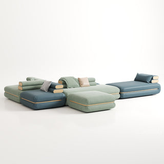 RINGCHEN modern modular cloud sofa with an ultra-low profile and deep-seated tofu block design, featuring a double-sided sectional configuration in a dual-material finish of premium sage green fabric and deep sea blue leather, showcased in a versatile, minimalist arrangement for spacious open-concept living rooms.-Three quarter view