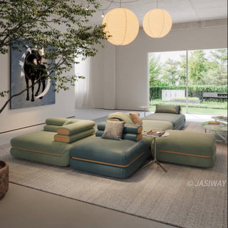 RINGCHEN modern modular cloud sofa with an ultra-low profile and deep-seated tofu block design, featuring a double-sided sectional configuration in a dual-material finish of premium sage green fabric and deep sea blue leather, showcased in a versatile, minimalist arrangement for spacious open-concept living rooms.-Wide shot