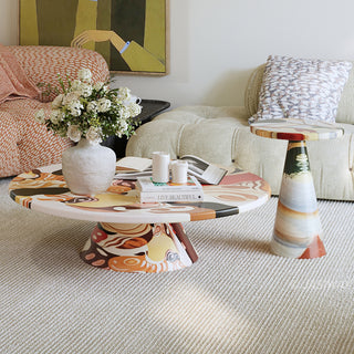 RINGCHEN organic modern 2-piece coffee table set featuring a sculptural round coffee table and matching tall side table with a vibrant, hand-painted abstract swirl pattern in warm earth tones, perfect as a functional art centerpiece for an upscale, eclectic, or avant-garde living room aesthetic.-Front view