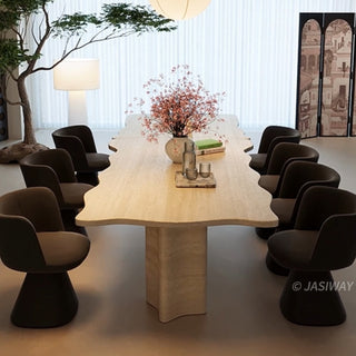 RINGCHEN organic modern dining table featuring a premium cream-toned travertine tabletop with a distinctive, scalloped live-edge silhouette. The sculptural rectangular design showcases the natural porous texture of authentic stone, supported by robust, monolithic block pedestals, ideal for luxury dining environments.-High-angle side view