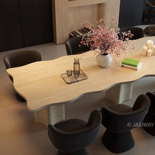 RINGCHEN organic modern dining table featuring a premium cream-toned travertine tabletop with a distinctive, scalloped live-edge silhouette. The sculptural rectangular design showcases the natural porous texture of authentic stone, supported by robust, monolithic block pedestals, ideal for luxury dining environments.-High-angle view