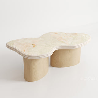 RINGCHEN sculptural cloud-shaped marble dining table featuring a luxury irregular cream-toned marble top with natural veining, supported by a sturdy dual solid wood pedestal base with a light natural oak finish, designed for modern minimalist and high-end designer dining rooms. -1High-angle view