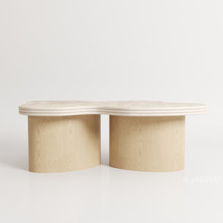 RINGCHEN sculptural cloud-shaped marble dining table featuring a luxury irregular cream-toned marble top with natural veining, supported by a sturdy dual solid wood pedestal base with a light natural oak finish, designed for modern minimalist and high-end designer dining rooms. -Front view