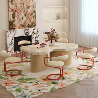 RINGCHEN sculptural cloud-shaped marble dining table featuring a luxury irregular cream-toned marble top with natural veining, supported by a sturdy dual solid wood pedestal base with a light natural oak finish, designed for modern minimalist and high-end designer dining rooms. -Three quarter view