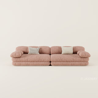 RINGCHEN luxury sculptural cluster jacquard sofa featuring a curved cloud-like silhouette, upholstered in premium textured designer fabric with a sophisticated pink and white micro-pattern, showcasing a low-profile modular frame, deep-seated comfort, and distinctive leather strap detailing on the rounded armrests for high-end living room interiors.-Front view