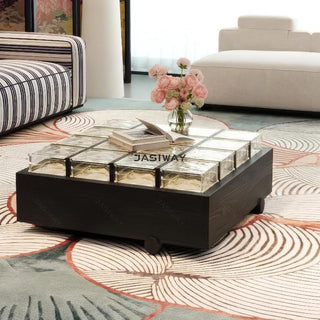 RINGCHEN sculptural coffee table with a grid of textured amber glass blocks set within a low-profile matte black wooden frame, highlighting the interplay of light through artisanal thick glass bricks, creating a sophisticated geometric cocktail table with a modern architectural silhouette and subtle spherical feet for a minimalist, grounded luxury aesthetic.-Diagonal view