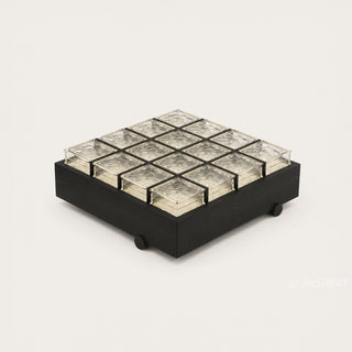 RINGCHEN sculptural coffee table with a grid of textured amber glass blocks set within a low-profile matte black wooden frame, highlighting the interplay of light through artisanal thick glass bricks, creating a sophisticated geometric cocktail table with a modern architectural silhouette and subtle spherical feet for a minimalist, grounded luxury aesthetic.-High-angle view of single unit