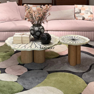 RINGCHEN sculptural lily pad coffee table set featuring irregular lotus leaf-shaped natural stone tops with intricate radial veining, supported by a cluster of solid wood pedestal bases. This luxury nesting coffee table set showcases a unique organic design with carved scalloped edges, blending artisanal craftsmanship with mid-century modern organic aesthetics for high-end designer living rooms.-Front view