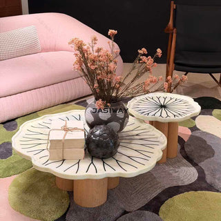 RINGCHEN sculptural lily pad coffee table set featuring irregular lotus leaf-shaped natural stone tops with intricate radial veining, supported by a cluster of solid wood pedestal bases. This luxury nesting coffee table set showcases a unique organic design with carved scalloped edges, blending artisanal craftsmanship with mid-century modern organic aesthetics for high-end designer living rooms.-High-angle view