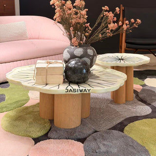 RINGCHEN sculptural lily pad coffee table set featuring irregular lotus leaf-shaped natural stone tops with intricate radial veining, supported by a cluster of solid wood pedestal bases. This luxury nesting coffee table set showcases a unique organic design with carved scalloped edges, blending artisanal craftsmanship with mid-century modern organic aesthetics for high-end designer living rooms.-Low-angle view