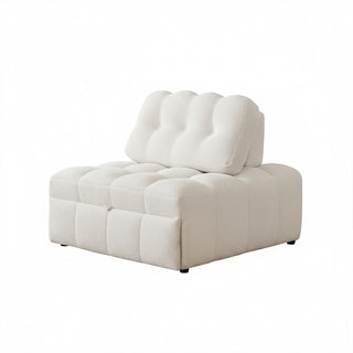 A white sherpa modular armchair is isolated on a pure white background, showcasing its tufted design and clean lines.