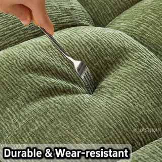 A close-up shot highlights the durable and wear-resistant texture of the olive green tufted chenille upholstery on a convertible sleeper sofa, tested with a fork.
