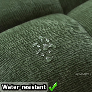 A close-up shot highlights the water-resistant fabric of the olive green tufted chenille convertible sleeper sofa, with water droplets beading on the textured surface.