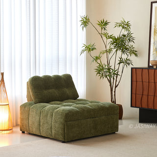 An olive green tufted chenille convertible sleeper sofa is styled in a bright, modern living room next to a tall potted plant and a warm floor lamp.