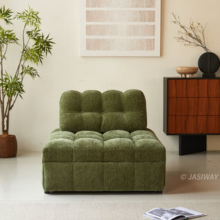 An olive green tufted chenille convertible sleeper sofa is showcased from the front in a bright, modern living room with a potted plant, a wooden console table, and an open magazine on the rug.