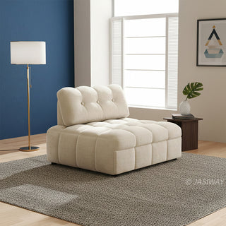 A beige tufted chenille convertible sleeper sofa is styled in a modern living room with a blue accent wall, a floor lamp, and a textured area rug.